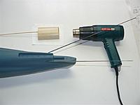 Name: P1020791.jpg
Views: 95
Size: 28.1 KB
Description: Using the heat gun to strait the push rod guiding tubes and the glazed plug curing.