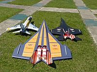 Name: P1030200.jpg
Views: 58
Size: 312.2 KB
Description: Next to 4.5Kwatt "F-100" and "Black Widow" after it's successful maiden. Stable as on rails.