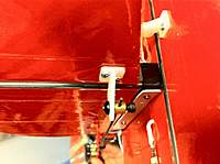 Name: photo 5.jpg
Views: 74
Size: 77.9 KB
Description: Carbon rod is also attached to the stick with a strap of thin plastic. This greatly stiffens the rudder. Notice all the Bubro Linkage. A must :)