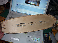 Name: P1020060.jpg
Views: 219
Size: 101.8 KB
Description: false deck on, with hatches cut. currently the fames below the hatches are still uncut. they will be cut when the planking is completed and serve as a reinforcement for the hatches