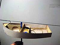 Name: Footy.jpg
Views: 196
Size: 46.5 KB
Description: This is it. The far servo controls the sail and the near one is for the rudder. The keel structure is two 6 mm CF square tubes. Way overkill.