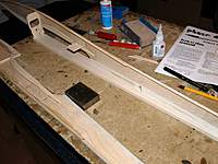 Name: Picture or Video 028.jpg
Views: 296
Size: 88.6 KB
Description: Pin the top plank down and glue everything to it.
A template is provided for setting the former as it does not sit at 90 degrees across the fuselage.