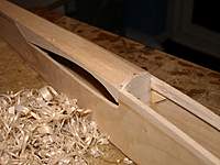 Name: Picture or Video 047.jpg
Views: 271
Size: 63.1 KB
Description: Could not look at the square bits any longer!! Just some rough carving. I think that it is better to plane the rear section before adding the cross-grain nose sheeting as the plane would catch it.