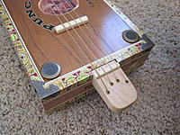 Name: IMG_0282.jpg
Views: 70
Size: 272.1 KB
Description: Bone Bridge, brass soundholes, and some picture frame corners from the craft store.