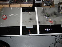 Name: IMG_4241.jpg
Views: 123
Size: 173.1 KB
Description: Booms attached to the lower side of the wing and servos installed.  Used some gift cards on edge poked through the lower wing and boom to aid adhesion.  It is all hot glued in place.  Receiver mounted to bottom of wing with a connection for the speed cont