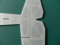 Name: DSCN2319.jpg
Views: 167
Size: 206.4 KB
Description: The control surface is then attached to the flying surface with a hair line gap between them. This again is to relieve hing tension. Two pieces of hinge tape are also installed on the bottom side of the hinge.