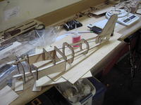 Name: 17.jpg
Views: 187
Size: 86.7 KB
Description: Another shot of the fuselage with the wing saddles glued in place.