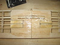 Name: 38b.jpg
Views: 189
Size: 84.3 KB
Description: The bottom of the wing fiberglassed.  This  might be a little overkill.