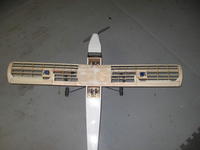 Name: 38p.jpg
Views: 163
Size: 39.2 KB
Description: The wing plugged into my trainer for calibrating the servos.  I also taped the ailerons onto the wing temporarily.