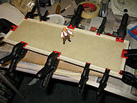 Name: tm27b.jpg
Views: 43
Size: 178.1 KB
Description: Clamping the hatch back seal to the deck piece.  Harder than you'd think.  I made a small edging guide to make sure it was lined up even to the edges all the way around.