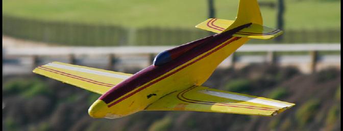 A P-51 racer shows itself well against the Point Fermin backdrop.  This is a premier Southern California flying site.  When the wind is pumping, you can fly practically anything off of the hill.  Landing however, can have a major pucker factor!
