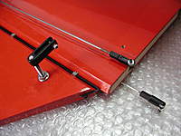 Name: 008.jpg
Views: 493
Size: 82.9 KB
Description: Here you can see how the wires lay. Also, I replaced the supplied 3/8"  4-40 clevis bolt with a 1/2" and an additional 4-40 lock nut. Look closely and you can see the nylon washers glued to the inside of the flying wire clevis on the longer one