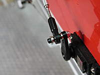 Name: 014.jpg
Views: 467
Size: 41.7 KB
Description: I added an extra cone standoff on the outside of the servo arm ball link to allow a bit more sweep for the pushrod. Also note the obligatory safety washer on the outside, lock nut on arm.
