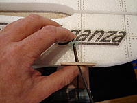 Name: DSC00126.jpg
Views: 178
Size: 159.5 KB
Description: Step 10c - Lay in on the fuselage using the notch in the bottom edge as reference on where the metal gear will protrude.