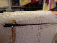 Name: DSC00271.jpg
Views: 180
Size: 124.0 KB
Description: Step 15 - Test fit, if satisfied remove the rod and lay in a bead of Welders, re-insert and wipe off any excess glue that squished out, fill any voids with additional Welders. Notice the extension beyond the firewall for added strength.