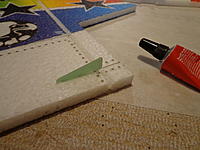 Name: DSC00105.jpg
Views: 151
Size: 182.3 KB
Description: Step 25a - Mark and cut a slot for the rudder horn 15mm up from the bottom edge. Rough up the tab of the horn with some sand paper and wipe clean.
