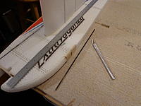 Name: DSC00212.jpg
Views: 149
Size: 251.7 KB
Description: Step 28b - Cut a slit for the rods, being sure to pass through the notch in the motor mount. Test fit.