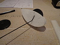 Name: DSC00192.jpg
Views: 144
Size: 234.1 KB
Description: Step 32b - Slit the inside surface to accept were the vertical part of the LG wire needs to pass thru. Check the angle first by mounting on the fuselage and mark. Glue and let dry.