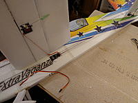 Name: DSC00236.jpg
Views: 197
Size: 235.5 KB
Description: Step 36c - Hook up your extensions from the tail servos cut a shallow slit and tuck the wires in.