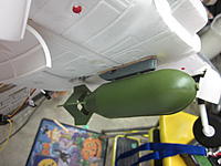 Name: Skyraider Bomb 2012-06-19 003.jpg
Views: 44
Size: 129.9 KB
Description: I still have to tap that servo under the bomb tail fins when I install the bomb to stop the buzz. Magnet coil would have been way easier.