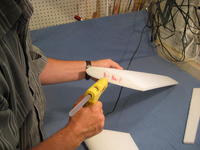 Name: 005.jpg
Views: 2712
Size: 72.1 KB
Description: Using a hot glue gun with on a low temp setting with  multi temp glue sticks, glue the two wing halves together.