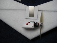 Name: 020.jpg
Views: 2745
Size: 64.0 KB
Description: The 16 gauge stainless steel motor mount is shown with a motor attached.  A second motor mount is in the position it will be on the finished airplane.  The motor will be taped on after the rest of the plane is finished.