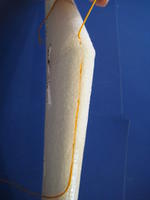 Name: RC5 014.jpg
Views: 2006
Size: 31.3 KB
Description: I am using the gold string so you can see it.  We normally use white to better match the foam.  Press the string into the slit in the foam with a small Phillips screwdriver.