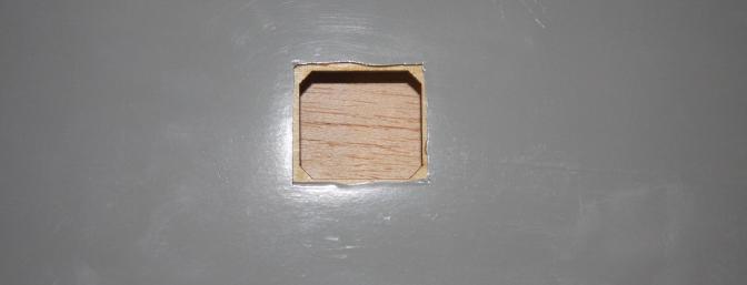The space for the aileron servo after cutting away the covering.