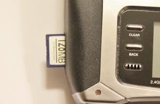 Inserting the supplied SD memory Card into the DX7s.