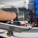 The metal coil carries water around the motor to keep it cool. Boat movement forces the water through the coil.