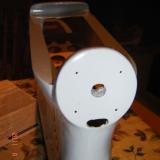 The motor mount ready for the motor. Four holes for the mounting bolts and space for the motor wires underneath.