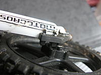 Name: M5 forkleg mudguard mod.jpg
Views: 48
Size: 124.2 KB
Description: Two small zipties through two small holes keeps the mudguard in place for a long time.