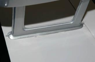 Not only does the hot glue provide a little extra adhesion, but it also helps seal the gap and prevent water infiltration into the wing.