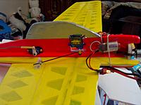 Name: 004.jpg
Views: 116
Size: 154.3 KB
Description: We opted to mount the aileron servo upside down to keep the rods as low as possible, Little dab of epoxy and Bam...mounted..
