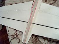 Name: 001.jpg
Views: 88
Size: 208.2 KB
Description: Cut a groove in the underside of the wing and used a carbon graphite tube as a stiffener, this time I did not epoxy it in place, but opted to use packing tape instead, can be re-used that way, just in case