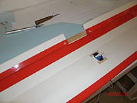 Name: GEDC0294.jpg
Views: 125
Size: 39.0 KB
Description: I use tongue depressor over rear wing edge. Popsicle sticks for mounting screws for servos glued to the wing.
