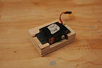 Name: MXC #2 006.jpg
Views: 321
Size: 32.1 KB
Description: JR9411 Flap servo with angles glued and drilled. Same jig will make left and right, simply put servo 180 from what you see. Using a jig like this every servo will have the same hole pattern.