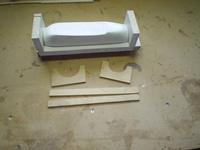 Name: Plug_ready_to_mold1.jpg
Views: 208
Size: 54.0 KB
Description: The plug mounted in the wooden frame for the mold. And some stabilizing parts for building up the mold.