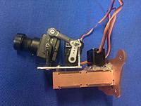 Name: IMAG0320.jpg
Views: 223
Size: 170.9 KB
Description: Camera supported on ball links and mounted onto a piece of aluminium angle with the tilt servo held with double side tape. Pan servo operates upside down and held with hot glue.