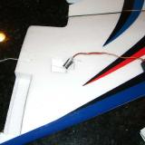 The factory positioned string is used to pull the servo lead into place through the wing panel.