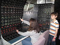 Name: 143.jpg
Views: 1912
Size: 121.6 KB
Description: My wife, Annette, acting as flight engineer.  You'll notice 8 columns of engine instruments, segregated into a left and right half.