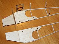 Name: esc 300.jpg
Views: 22
Size: 171.6 KB
Description: Former, u/c plate and some cross braces added to one fuselage side. Note the score in the second side, so the nose can pull in.