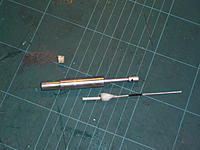 Name: P1040831.jpg
Views: 126
Size: 287.5 KB
Description: Components of the cartridge, party popper with shrinktube fitted to coincide with the grub screw on the firing pin, I use a small piece of balsa as packing then the black powder paint