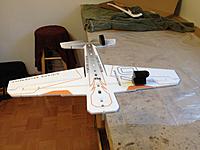 Name: IMG_1101.jpg
Views: 575
Size: 168.6 KB
Description: Now that the upper fuse is on you need to hang the whole plane off the side of your building surface and use weights to hold it in place.