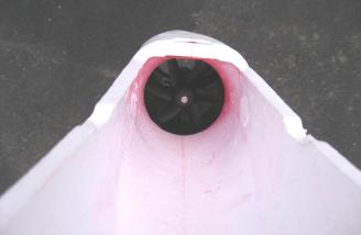 Looking through the underside of the fuselage and toward the tail to see the ducted fan already mounted and connected to the ESC.