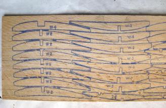 This is printwood from a World War II era kit. Try and cut these out with even the sharpest of knives. One slip and you have ruined parts.