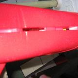 The fin slot varies in depth to accomodate tabs on the vertical fin.
