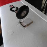 The main landing gear slips into these plastic pockets. Easy to remove the gear if you want to fly with them retracted, but the nose gear takes a little more effort.