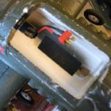 There is a roomy battery compartment with a plastic snap latch.