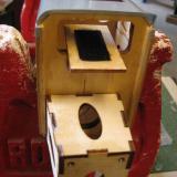 The ESC mounts to its own shelf, close to the motor and directly in the flow of air through the cowl.  (The fuselage is inverted in this picture.)